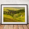 Photo of Dent Viaduct and ruined barn surrounded by lush woodland in the Yorkshire Dales. England