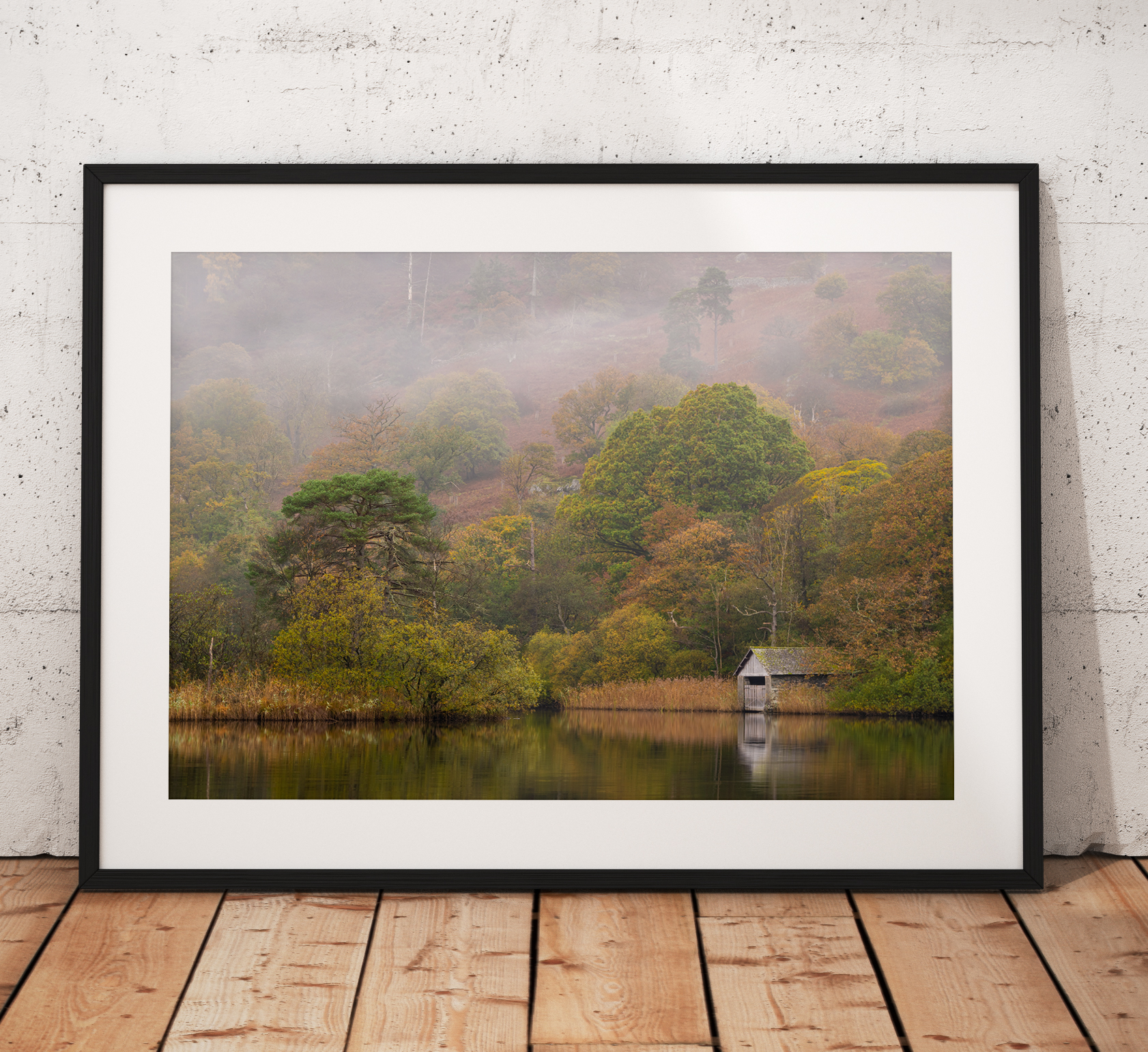 Beautiful autumnal misty photograph taken of the boat house on Rydal Water, Lake District, England.