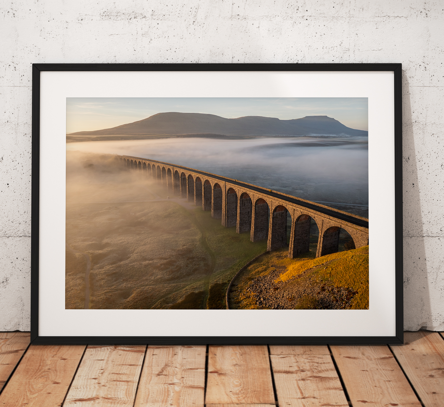 A glorious foggy morning at Ribblehead viaduct with Ingleborough rising in the distance
